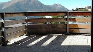 A balcony with a view of a mountain.