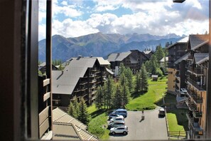 Surrounded by lush greenery and snow-capped mountains, this mountain resort offers a serene retreat.