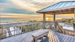 A wooden deck with a bench overlooking a beach at sunset. - 2 min to the beach with 30A's largest pool, plus stunning decks, and 4 bikes (Santa Rosa Beach)