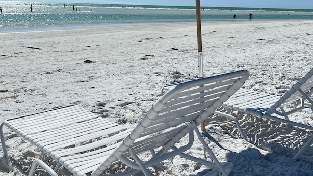 A beach scene with a blue umbrella and white lounge chairs. - Sunny House with heated pool, 12min drive to Engelwood Beach, Port Charlotte FL (Port Charlotte)