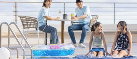 Seasonal outdoor pool, open 9:00 AM to 9:00 PM, pool umbrellas