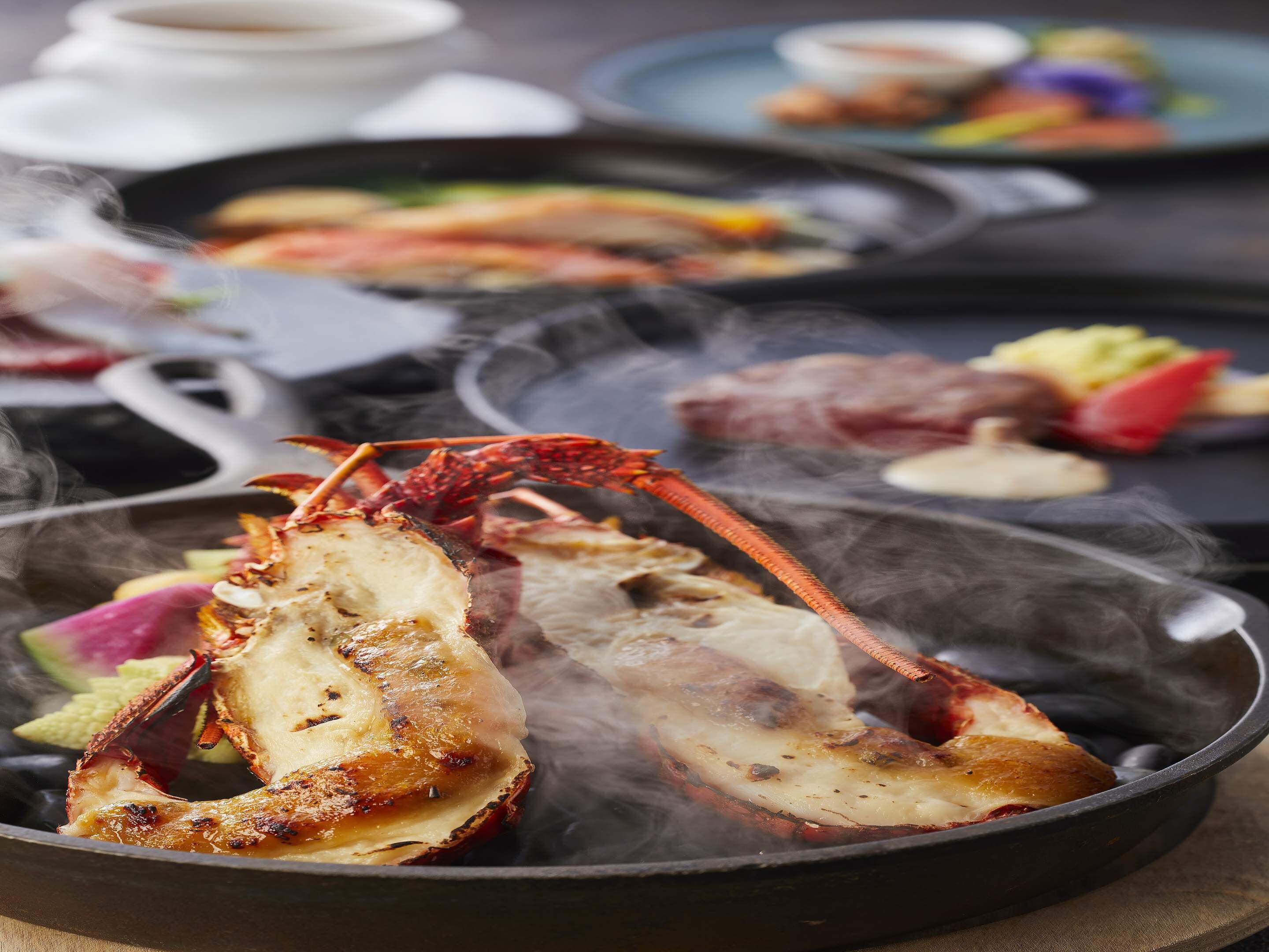 A seafood grill with lobster and other dishes.