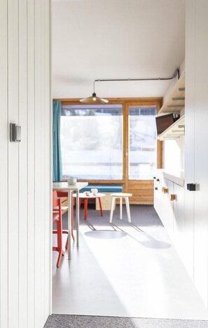 Enjoy a functional and stylish space with a dining area, comfortable seating, and a bright atmosphere.