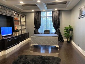 Work in comfort with a spacious desk and ample storage.