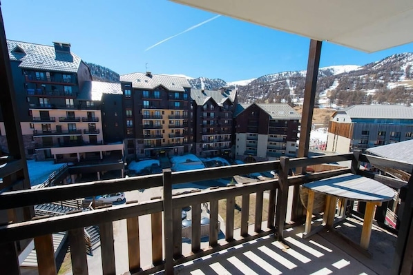 Enjoy breathtaking views of the ski resort from this balcony.