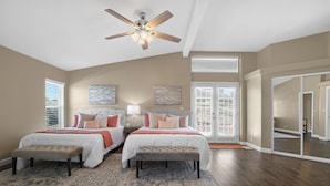 A bedroom with two beds, a ceiling fan, and a large window with blinds. - 2 Patios, BBQ, Center Wine Country (Temecula)