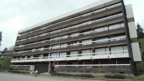 A multi-story building with balconies, likely a residential or hotel structure. - 150m from ski slopes, 3rd floor, balcony, tv, 25m², Chamrousse (Chamrousse)