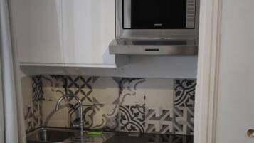 Fridge, microwave, coffee/tea maker, toaster