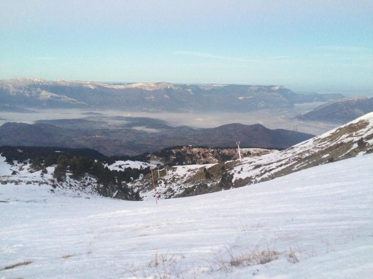 A snowy mountain landscape with a clear sky.