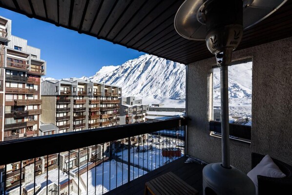 Enjoy breathtaking views of the snow-covered mountain range from this hotel's balcony.