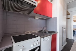 Effortlessly cook and entertain in this well-designed kitchen with a gas stove, oven, and compact dishwasher.