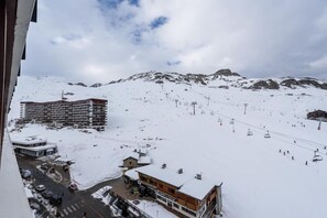 Experience the thrill of skiing at this mountain resort, where a ski lift whisks you up to groomed slopes.