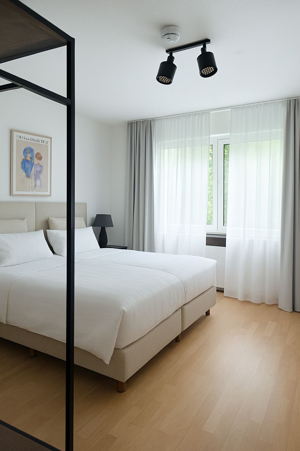 A modern bedroom with a large bed, a bedside table, a lamp, a ceiling light fixture, and a window with curtains.