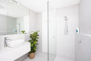 Shower, hair dryer, towels, soap