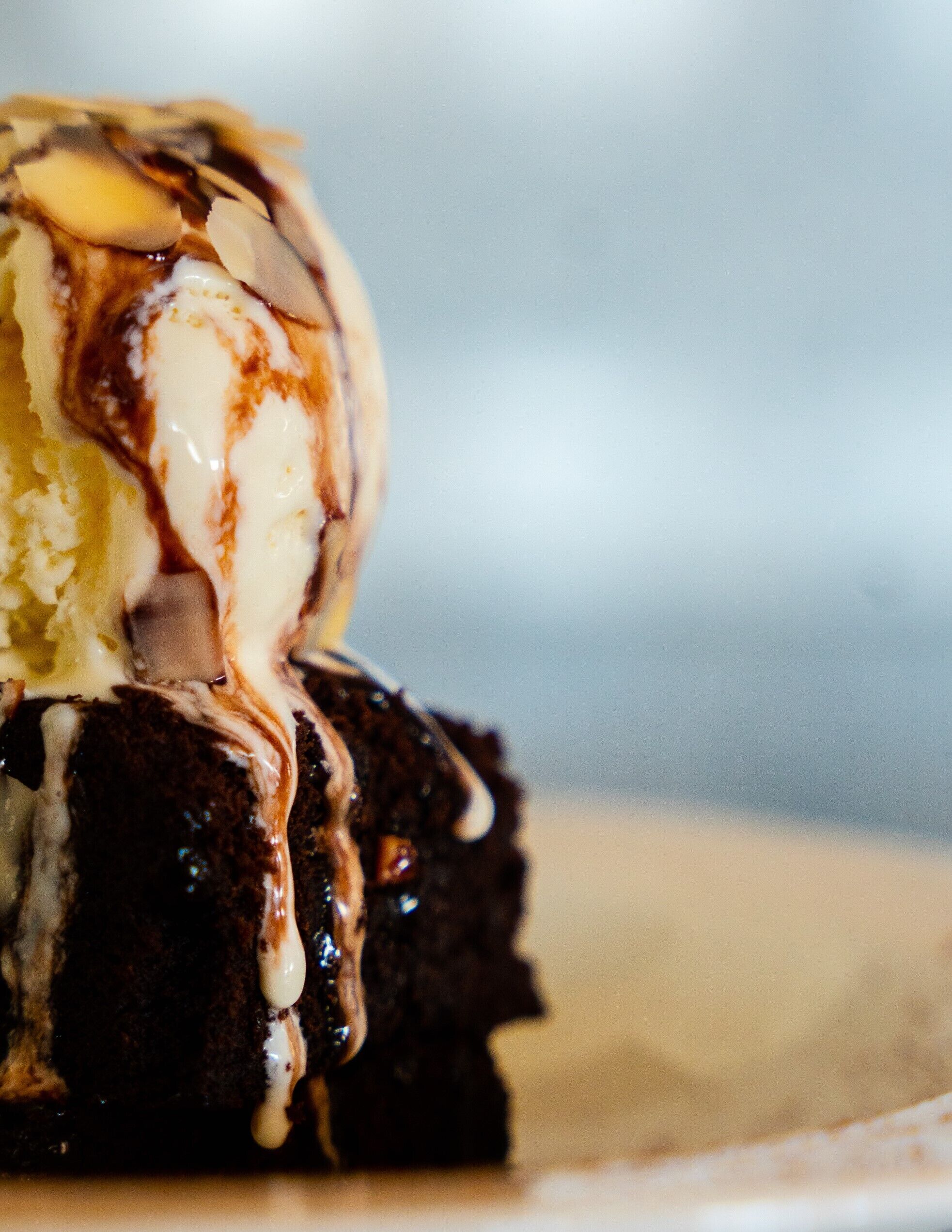A dessert with ice cream and chocolate sauce.