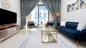 Premium Apartment | Living area | 53-inch Smart TV with satellite channels, TV - SuperHost - Spacious Apartment With Balcony In Sobha Hartland (Dubai)