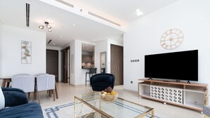 Premium Apartment | Living area | 53-inch Smart TV with satellite channels, TV - SuperHost - Spacious Apartment With Balcony In Sobha Hartland (Dubai)