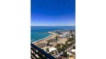On the beach, sun loungers, beach towels