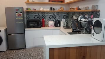 Deluxe Double Room, Accessible | Private kitchen | Fridge, high chair