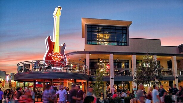 A Hard Rock Cafe with a large guitar sign, outdoor seating, and a modern building with large windows. - 💎Waterfront Views | Great Amenities | AAA Four Diamond Resort | The Marina 5-301 (Myrtle Beach)