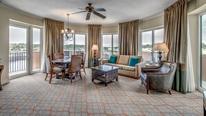 A hotel room with a dining area, a sofa, a chair, a coffee table, and a ceiling fan. - 💎Waterfront Views | Great Amenities | AAA Four Diamond Resort | The Marina 5-301 (Myrtle Beach)