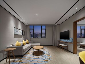 Deluxe Suite, 1 King Bed | Living area | 55-inch LED TV with cable channels, TV, fireplace - Hilton Garden Inn Jincheng Gushuyuan (Jincheng)