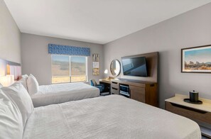 Desk, laptop workspace, iron/ironing board, bed sheets