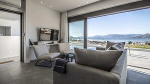 A modern living room with a large window overlooking a scenic view.