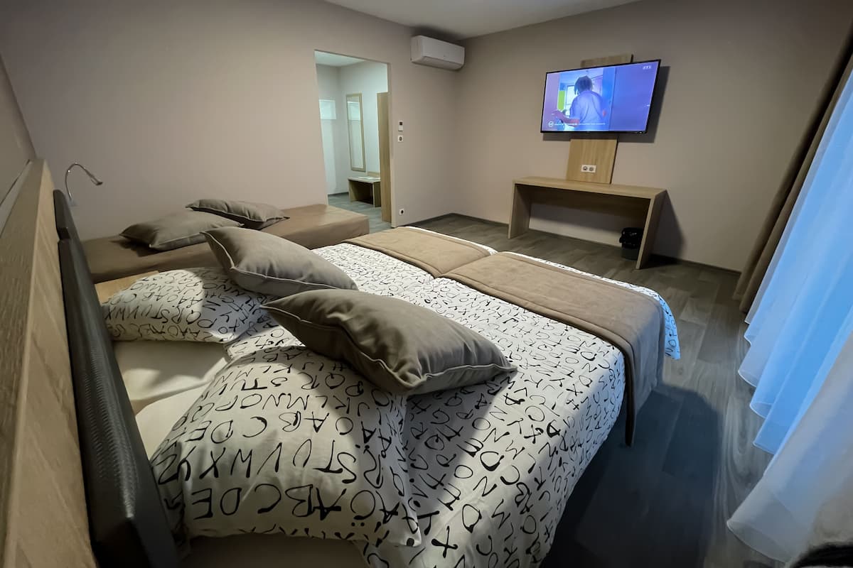 Comfort Quadruple Room | Premium bedding, memory foam beds, desk, laptop workspace