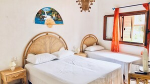 A room with two single beds, a hanging light fixture, a painting on the wall, and a window with curtains. - Blue Med Scooby, Palinuro, Cilento (Palinuro)