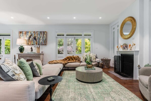 Informal Living Room with Wood Burning Fireplace