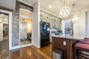 Microwave, dishwasher, coffee/tea maker, cookware/dishes/utensils