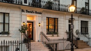 St. David's Hotels with a classic facade, a gated entrance, and a well-lit street lamp. - St. David's Hotels (London)