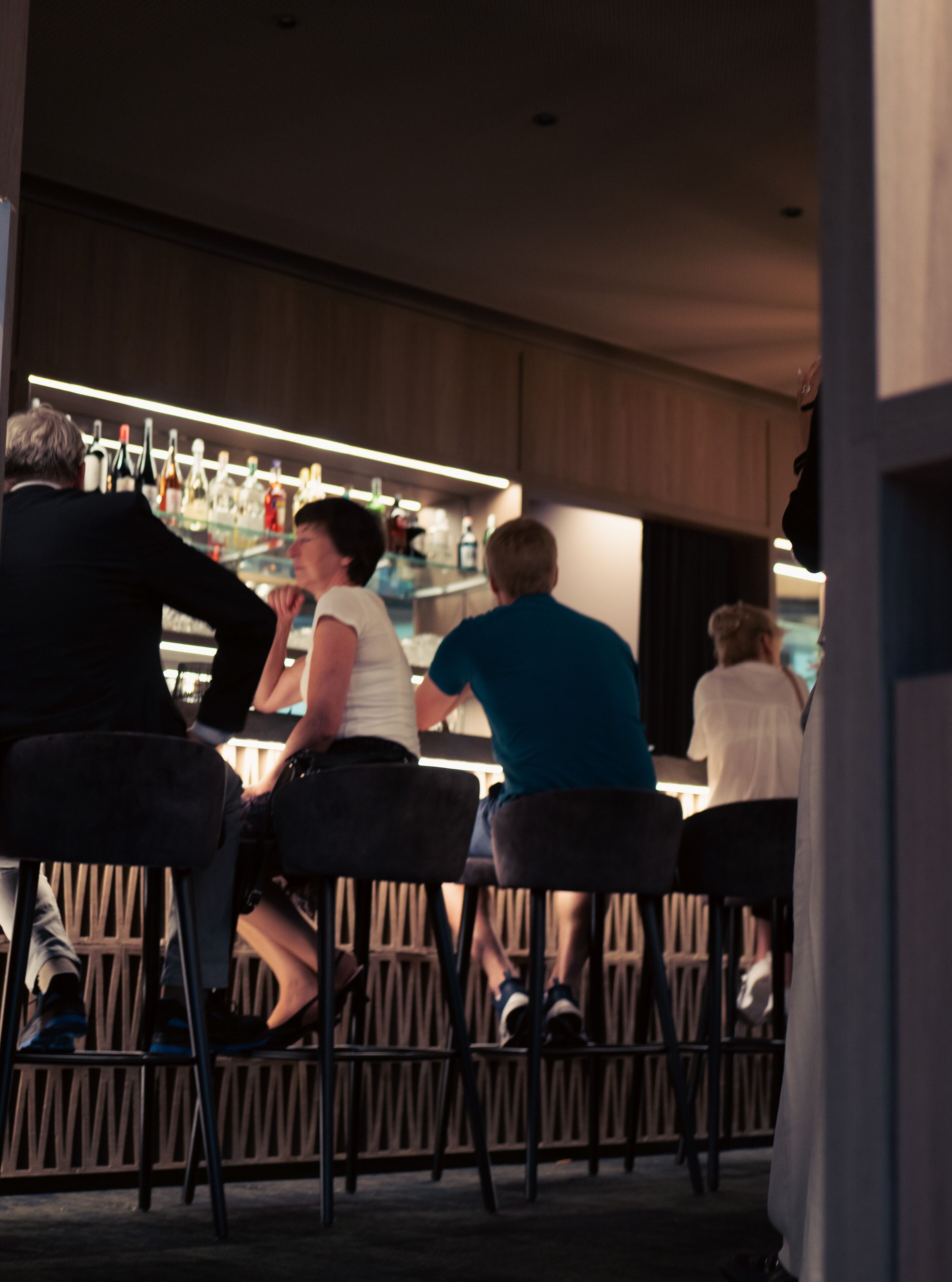 A bar area with seating and a bar counter.
