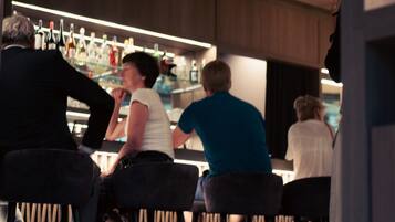A bar area with seating and a bar counter.