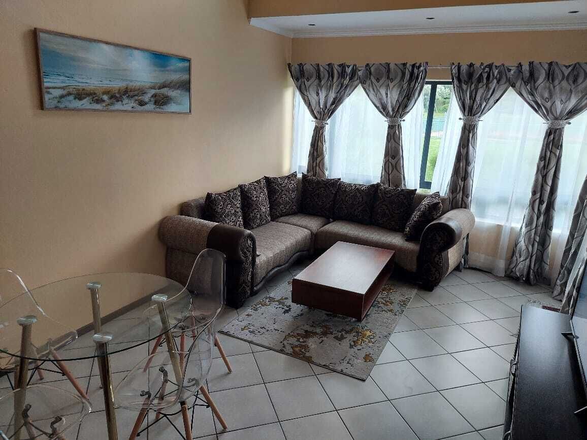 Apartment with Lush green garden and a Pool