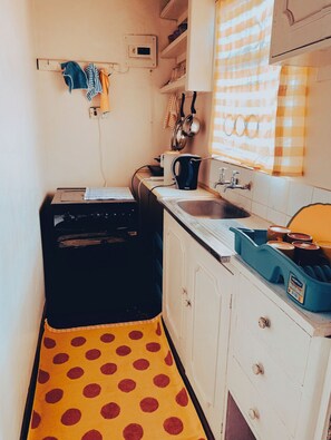 Microwave, stovetop, coffee/tea maker, electric kettle