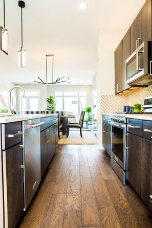 Enjoy cooking in this well-lit kitchen with a central island and dining area view.