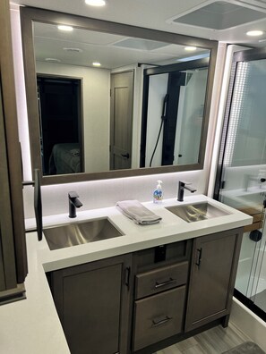 Bathtub, hair dryer, towels, soap