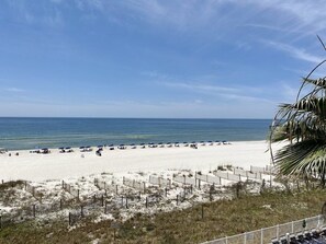 Enjoy sunbathing and relaxation on the wide, sandy beach with comfortable lounge chairs and umbrellas.