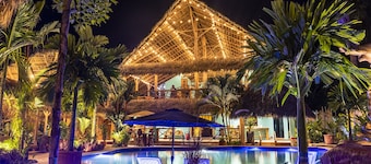 Private beach house paradise w/ private pool bar and game area.