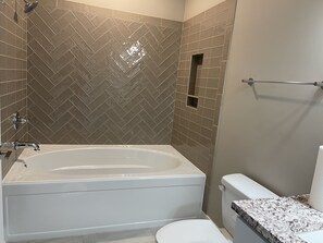 Combined shower/bathtub, hair dryer, towels, soap