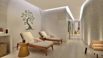 Uma área de spa moderna com duas poltronas de descanso, um mural de árvore na parede e um espaço de estar com reflexos.