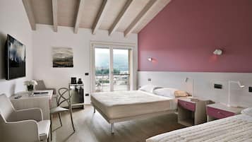 Deluxe Triple Room, Kitchenette | Minibar, in-room safe, desk, blackout drapes