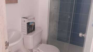 Shower, hair dryer, towels, soap