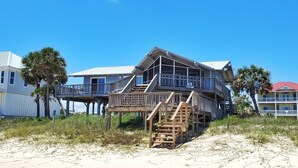 A beachfront house with multiple decks and a covered outdoor area. - Beachfront! Screen Porch (St. George Island)