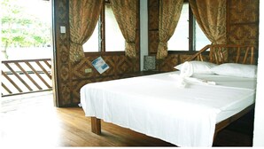 A single bed with white linens in a room with wooden walls and floors. - Purple Snapper Dive Resort - Hostel/backpacker Accommodation (Daanbantayan)