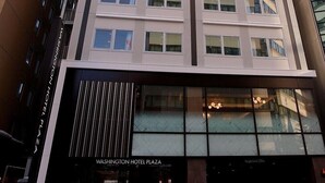 A tall hotel building with a modern facade, multiple floors, and a prominent sign at the top. - Sapporo Washington Hotel Plaza (Sapporo)