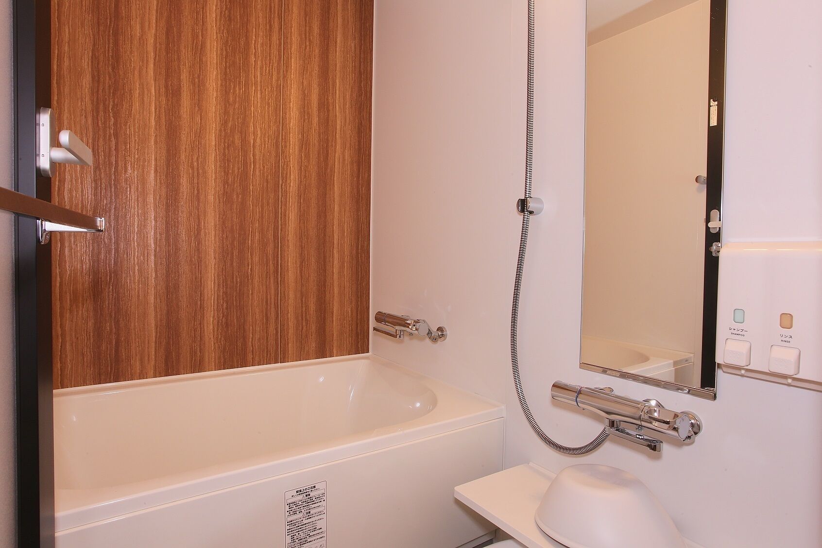 separate bathtub and shower, hair dryer, slippers, electronic bidet