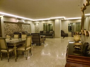 Apartment | Living room | 30-inch TV with cable channels - Spacious Executive Luxury Apartment With Balcony (Giza)